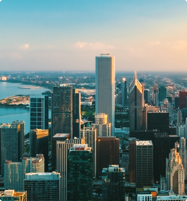 The city of Chicago is photographed, with the Aon Center in the center.